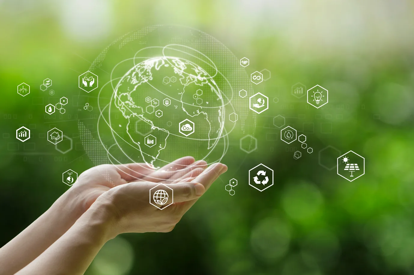 earth holded in hands with green background and innovation technologies